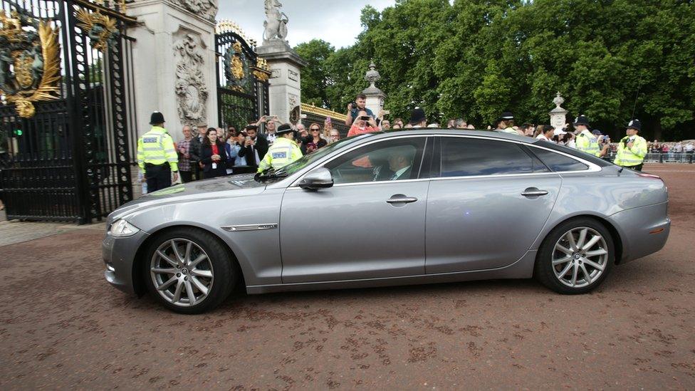 Car arriving at Buckingham Palace