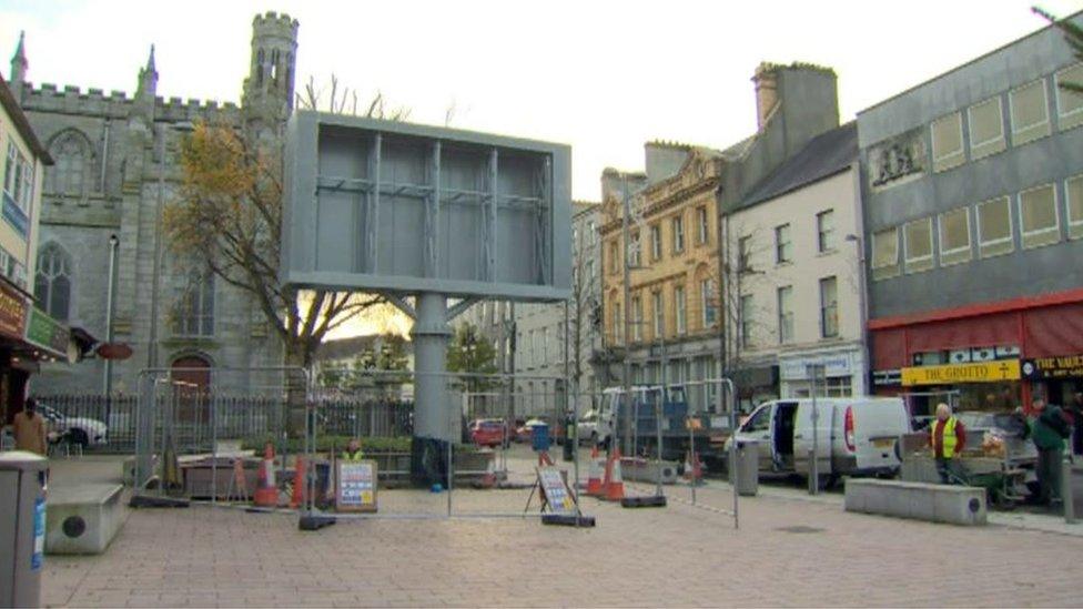 The screen beside Newry Cathedral