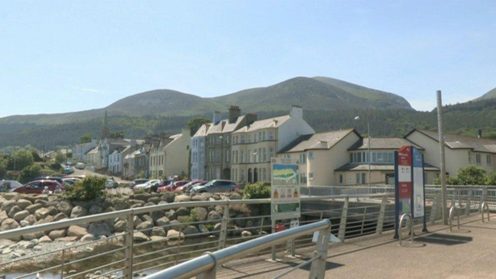 Newcastle promenade with the Mourne Mountains in the background