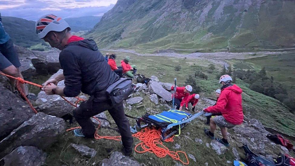 Members of Keswick Mountain Rescue Team rescuing an injured man