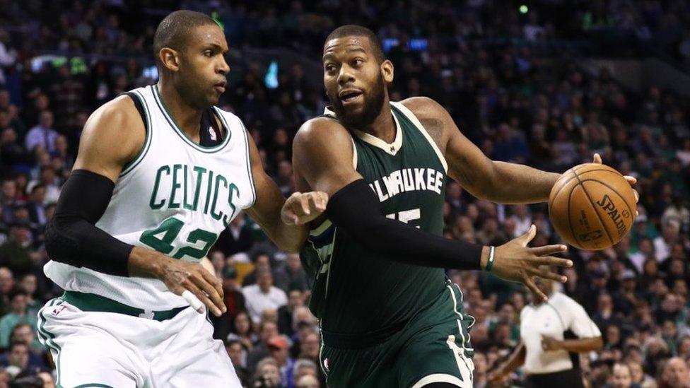 Al Horford of the Boston Celtics defends against Greg Monroe of the Milwaukee Bucks