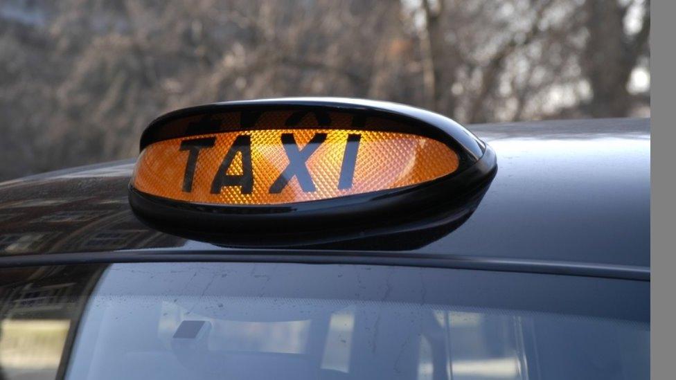 A generic illuminated taxi sign