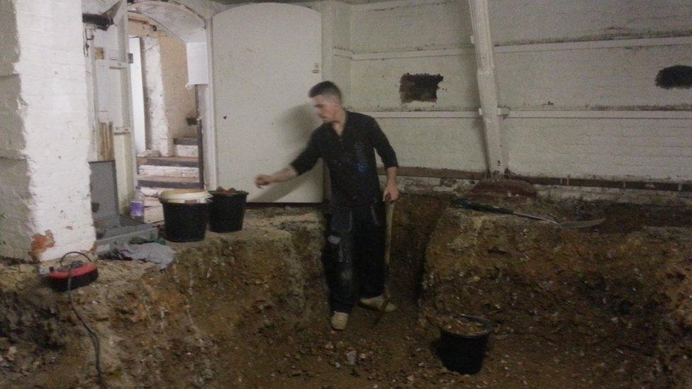 Ben Collins working in the cellar