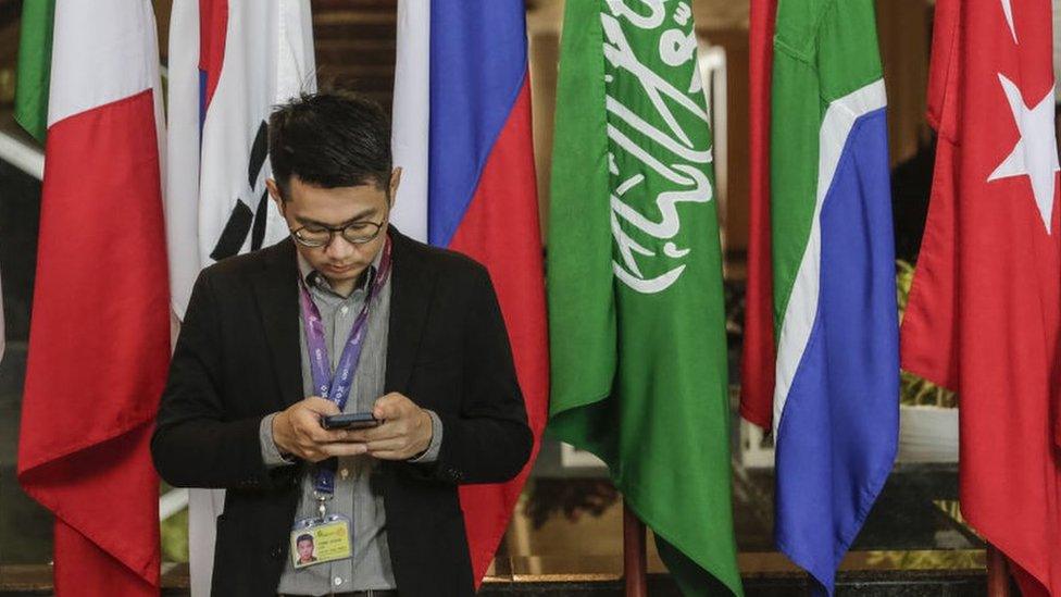 Journalists work at the media centre during G20 Leaders' Summit in Bali, November 2022