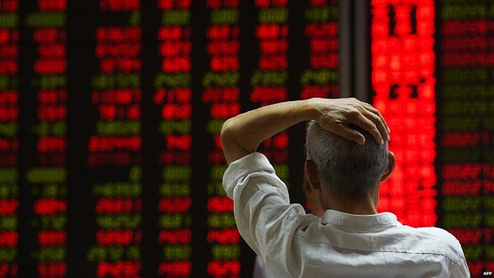 A Chinese investor looking anxiously at stock prices.