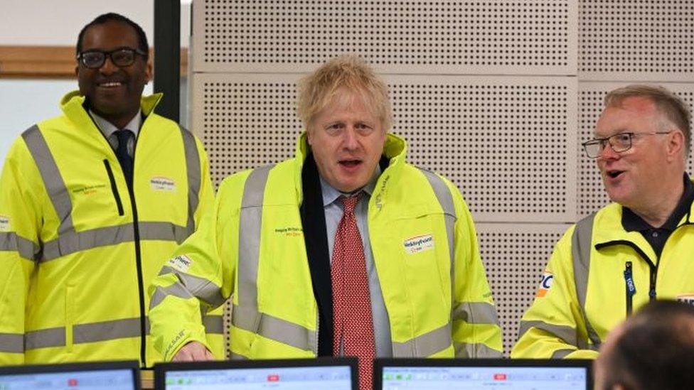 Prime Minister Boris Johnson (2ndR), Britain's Business Secretary Kwasi Kwarteng (2ndL), Hinkley Point C managing director Stuart Crooks