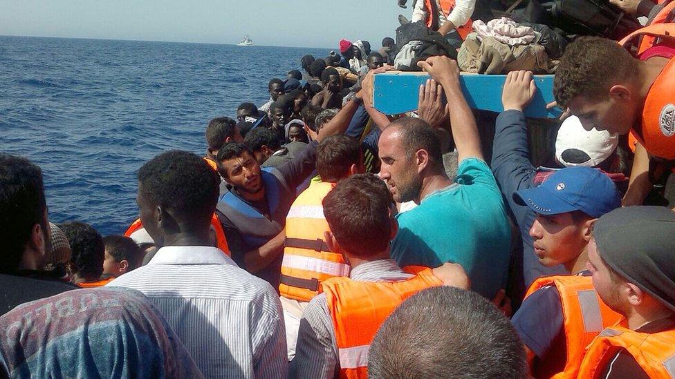 Migrants aboard a boat from Libya - file pic