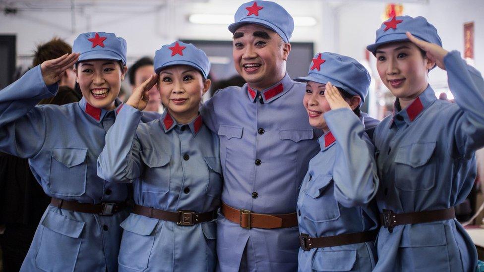 Cantonese opera actors salute backstage before performing in a show, 4 October 2016