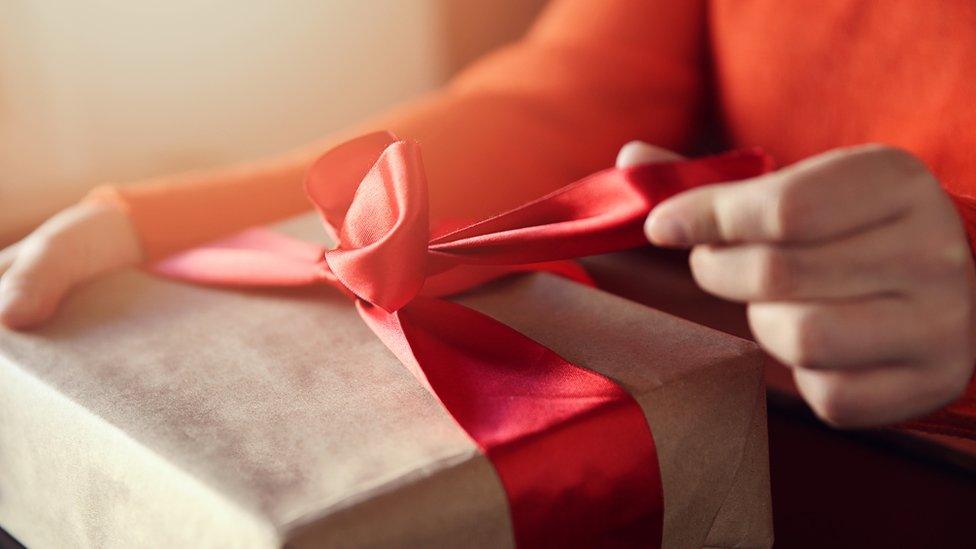 Woman opening Valentine's Day present