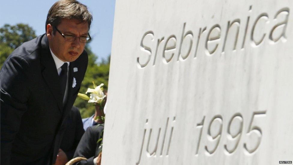 Serbian Prime Minister Aleksandar Vucic places flowers during a ceremony marking the 20th anniversary of the Srebrenica massacre in Potocari, near Srebenica, Bosnia and Herzegovina on 11 July 2015