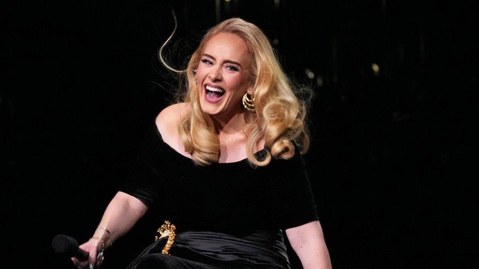 Adele smiles as she performs during the first night of her residency in Las Vegas