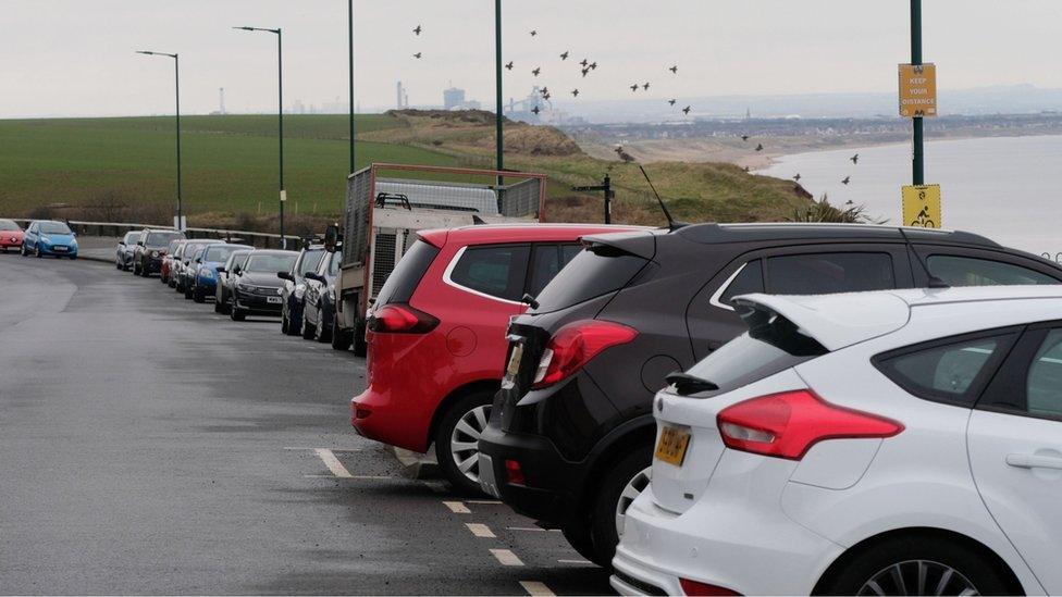 Cars parked along Marine Parade