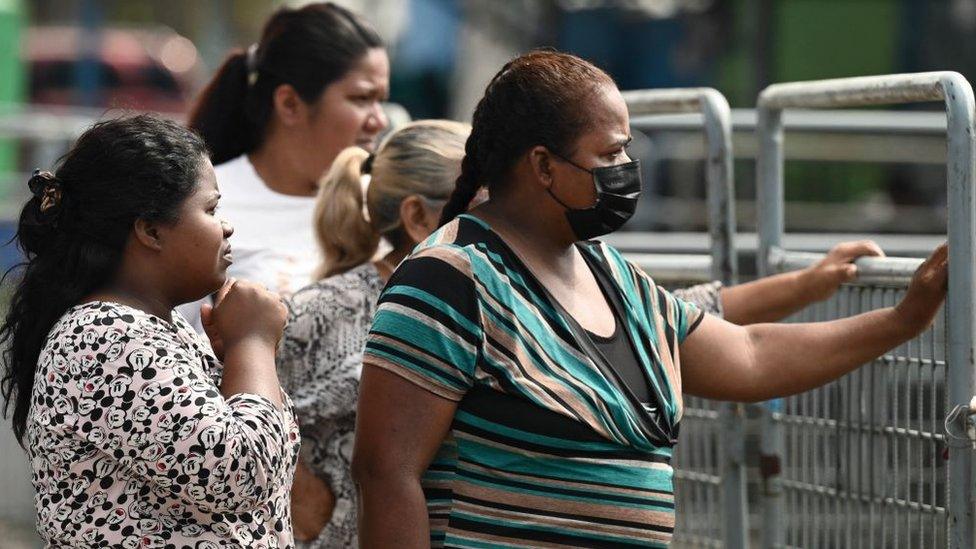 Relatives wait for information outside the Guayas 1 prison a day after a fight between rival gangs left six inmates dead in Guayaquil, Ecuador, on July 24, 2023.