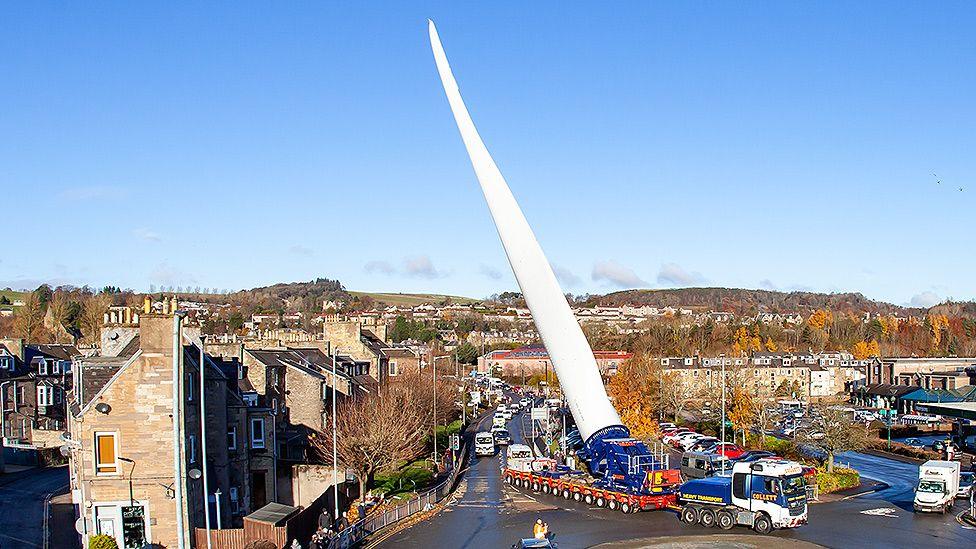 A giant turbine on the back of a lorry makes its way through the centre of Hawick