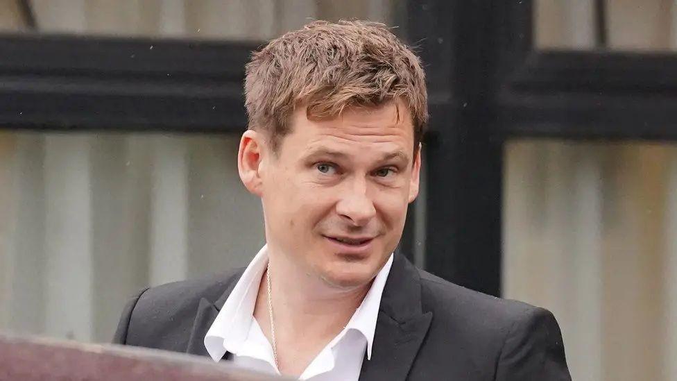 Blue star Lee Ryan outside court in 2023