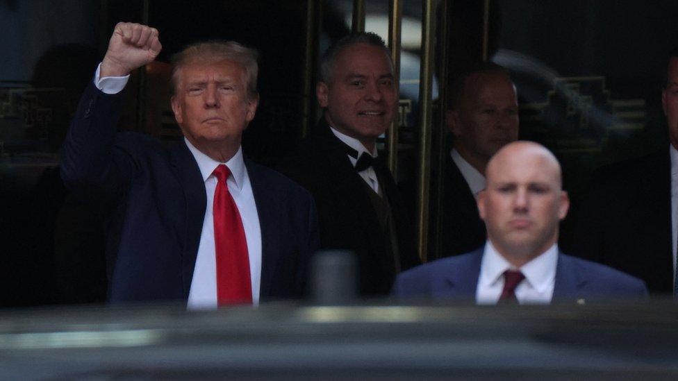 Donald Trump raises fist