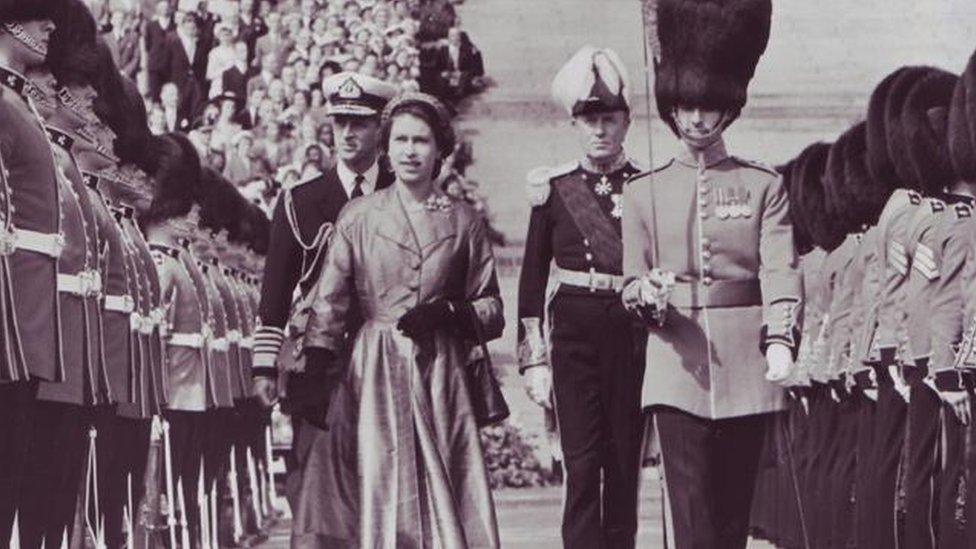 The Queen inspects a line of Irish Guards at Stormont, Northern Ireland, in 1953