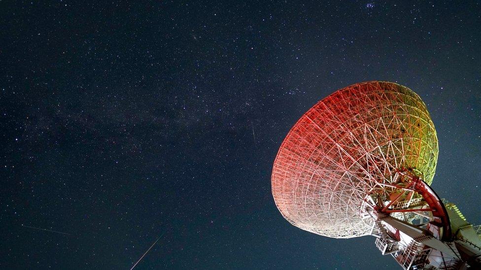 A meteor streaks across the sky over the National Observatory Miyun Station during the Perseid meteor shower on August 13, 2023 in Beijing, China.