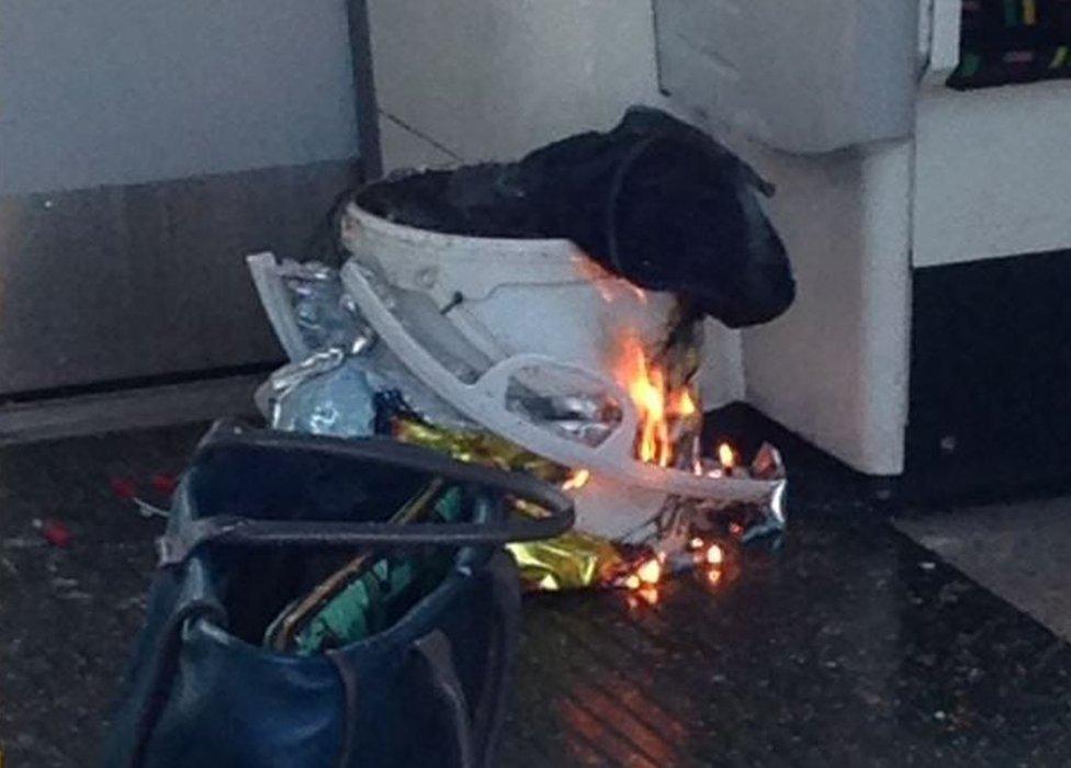 White bucket on fire on Tube train