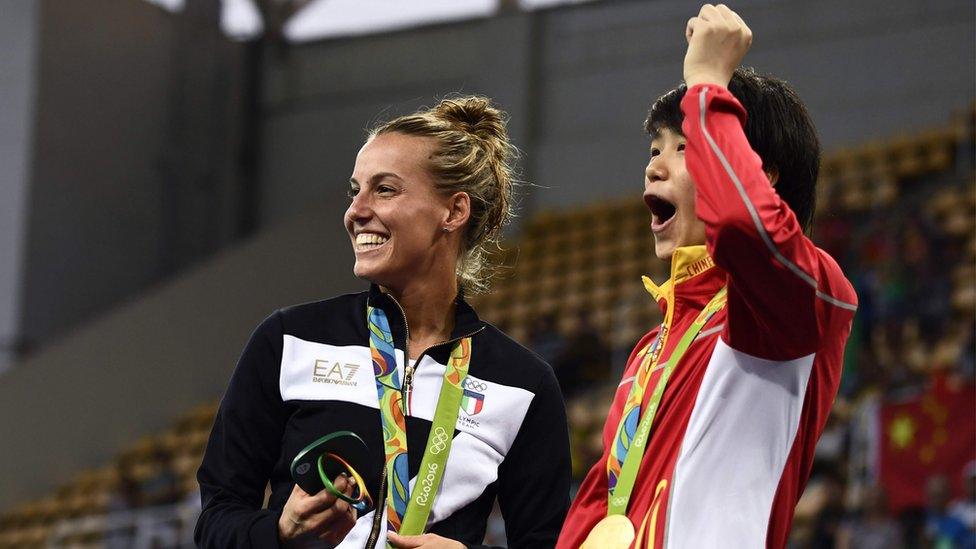 Gold medallist China's Shi Tingmao (R) and bronze medallist Italy's Tania Cagnotto react