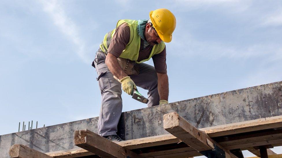 Builder working on a roof