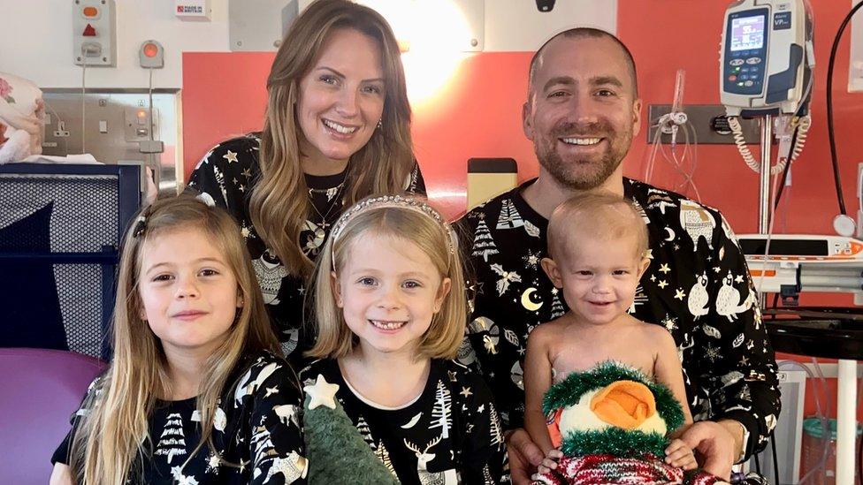 Orla with her parents and sisters in hospital