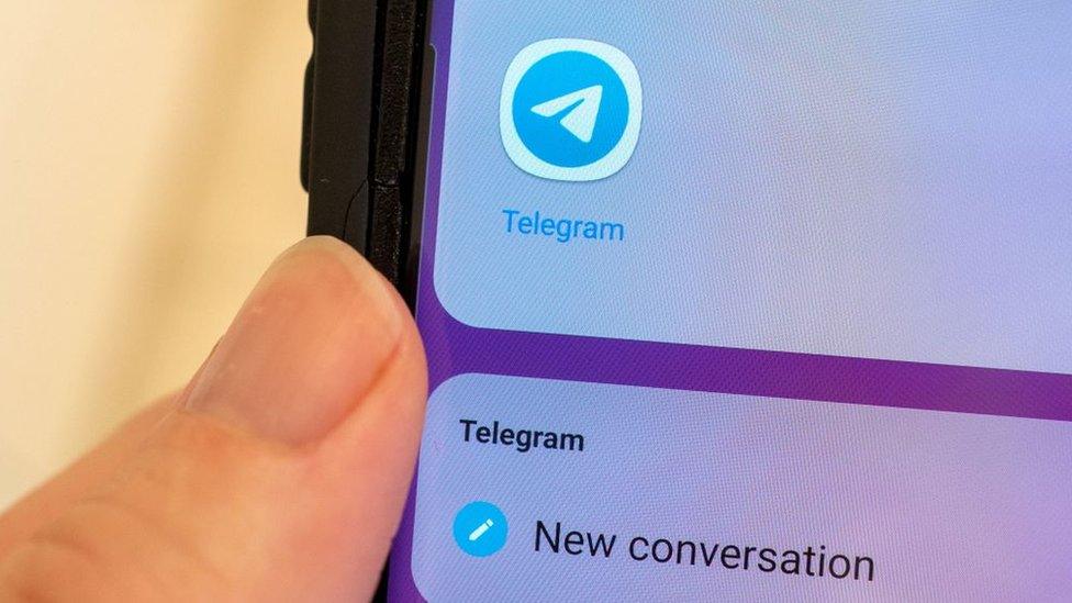 A person using the Telegram messaging app