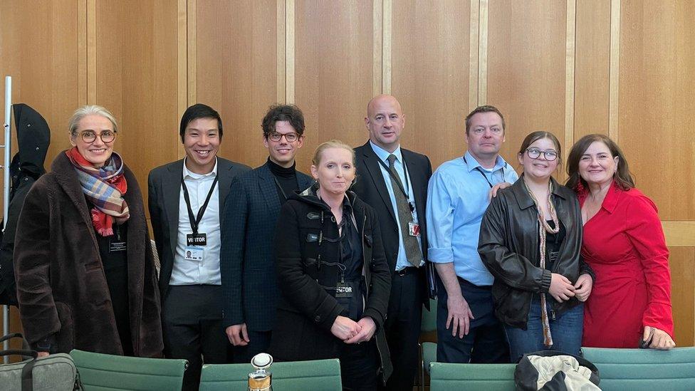 Picture of several people in the houses of parliament