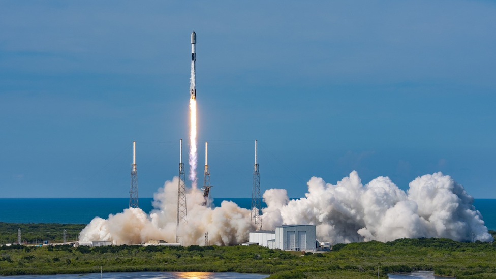 A SpaceX rocket blasting off from Cape Canaveral carrying Starlink satellites