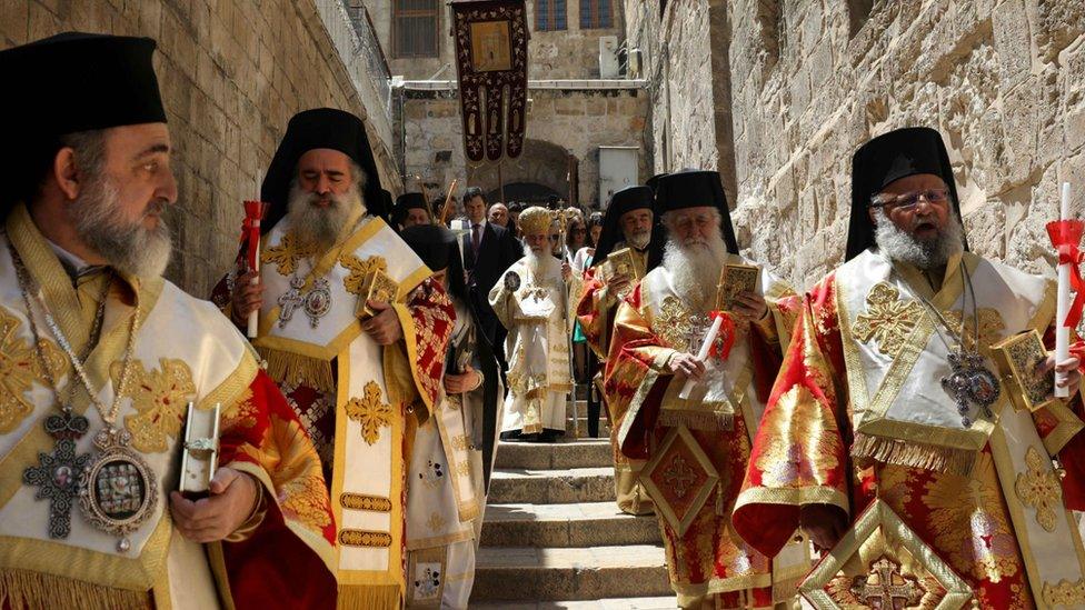 Greek Orthodox Patriarch of Jerusalem Theophilos III (C) leads the Easter Sunday traditional procession toward the Church of the Holy Sepulchre in Jerusalem's Old City