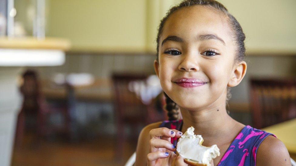 girl with cheese bagel