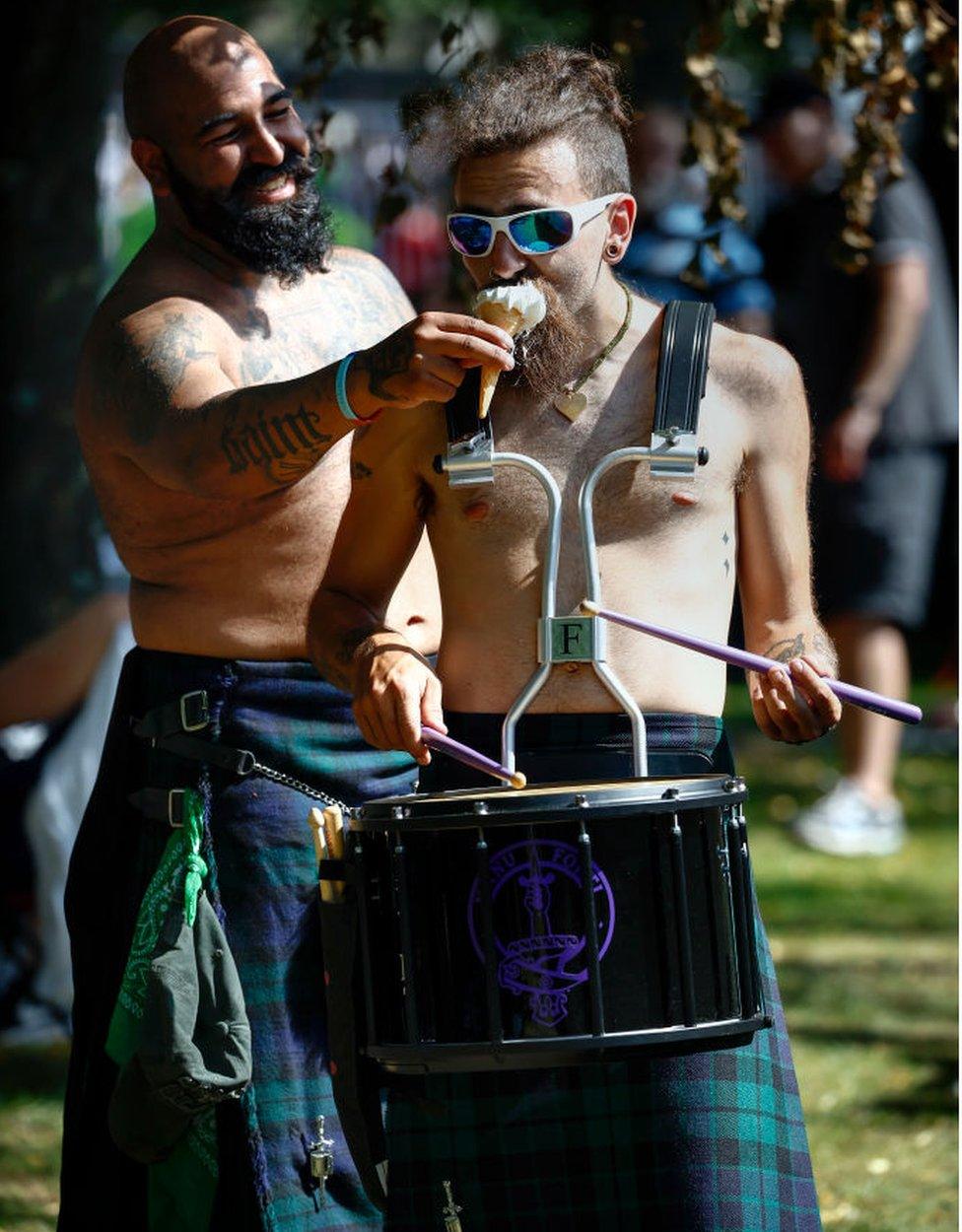 drummer eats ice cream while playing the drums