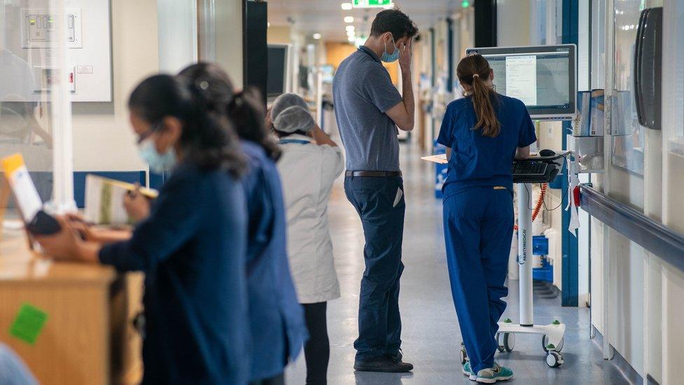 Staff at work in a hospital corridor