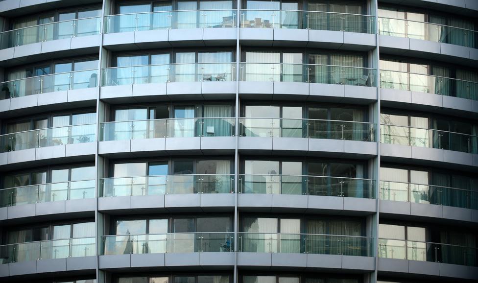 Facade of the Bezier block, with empty chairs on balconies