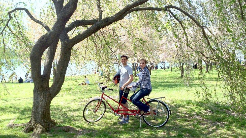 Charity Tillemann-Dick and her husband with a bicycle