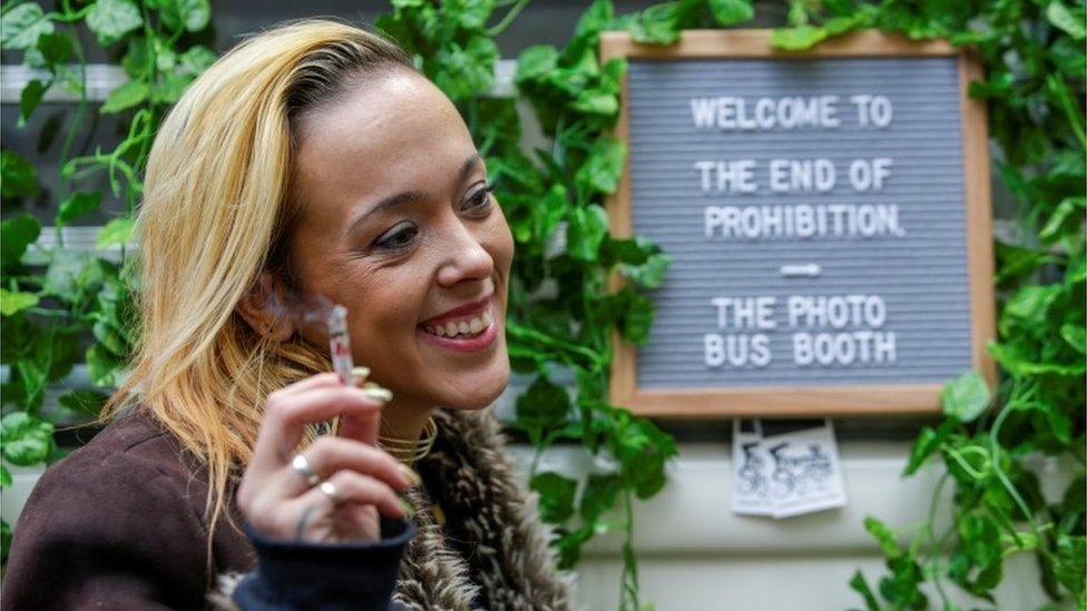 Kristy Calkins poses for photos during a "wake and bake" event on the day Canada legalizes recreational marijuana in Toronto.