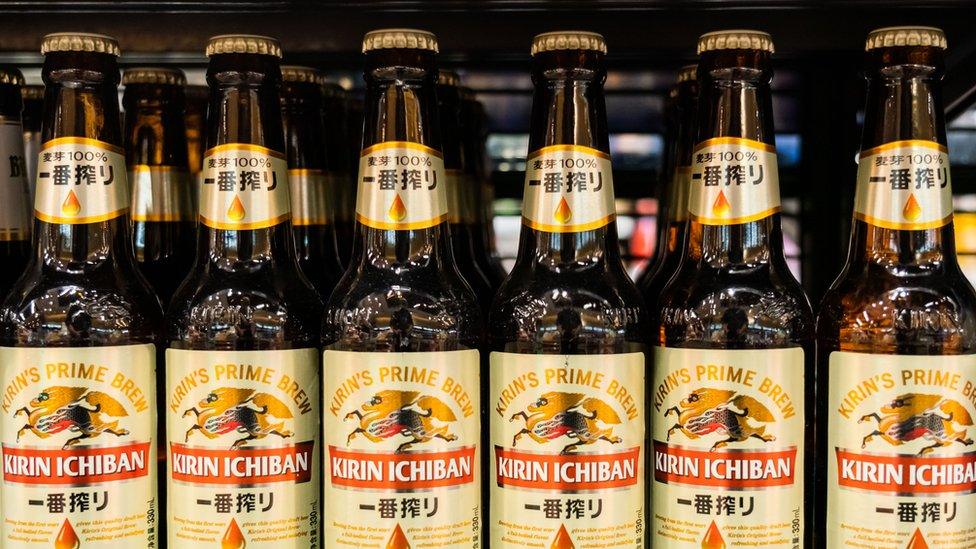 Kirin beer bottles on a shelf.