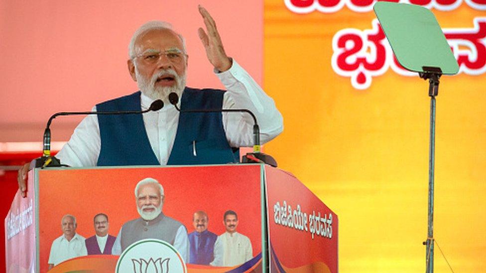 Prime Minister Narendra Modi addresses a gathering of supporters during a political event organised by the Bharatiya Janata Party (BJP) at the GMIT College Grounds on March 25