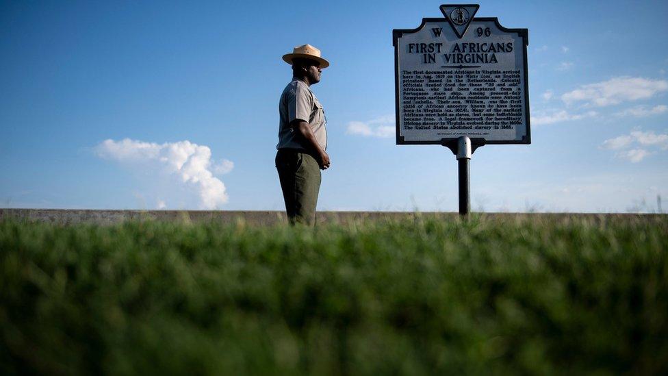 Sign marking point where African slaves were first brought to the US