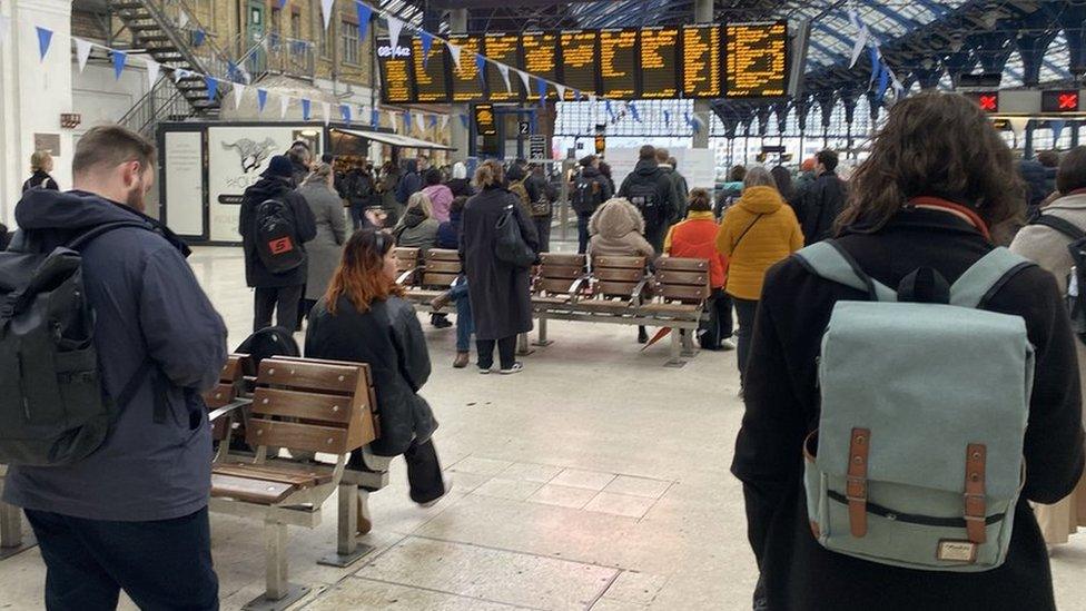 Passengers waiting at Brighton Station