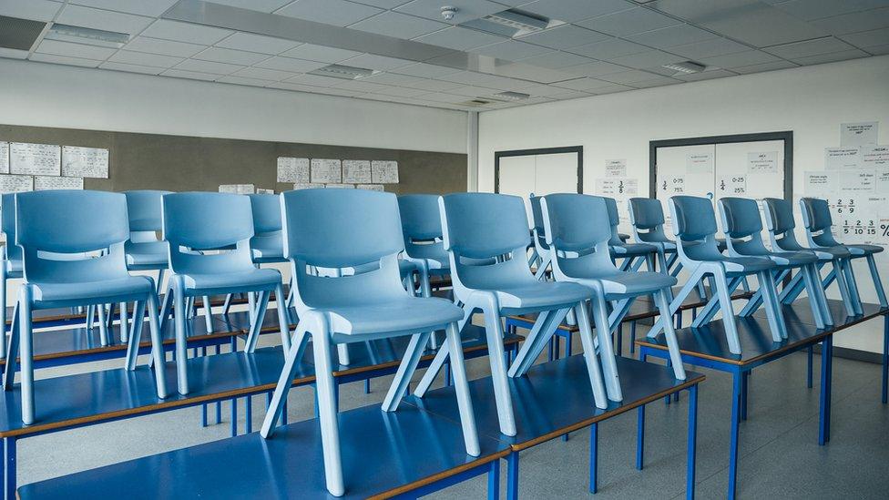 Chairs on tables in a school classroom