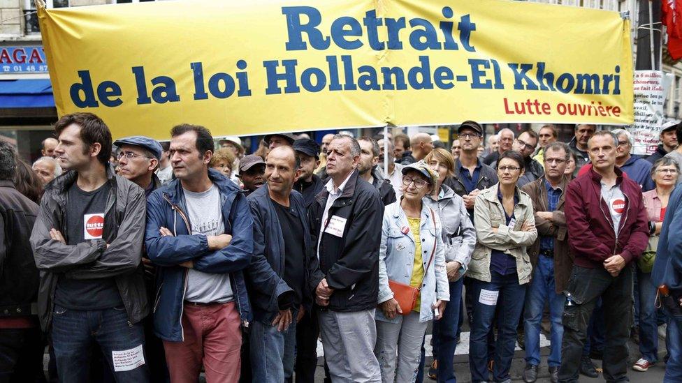 Members of France"s "Lutte ouvriere " take part in a protest