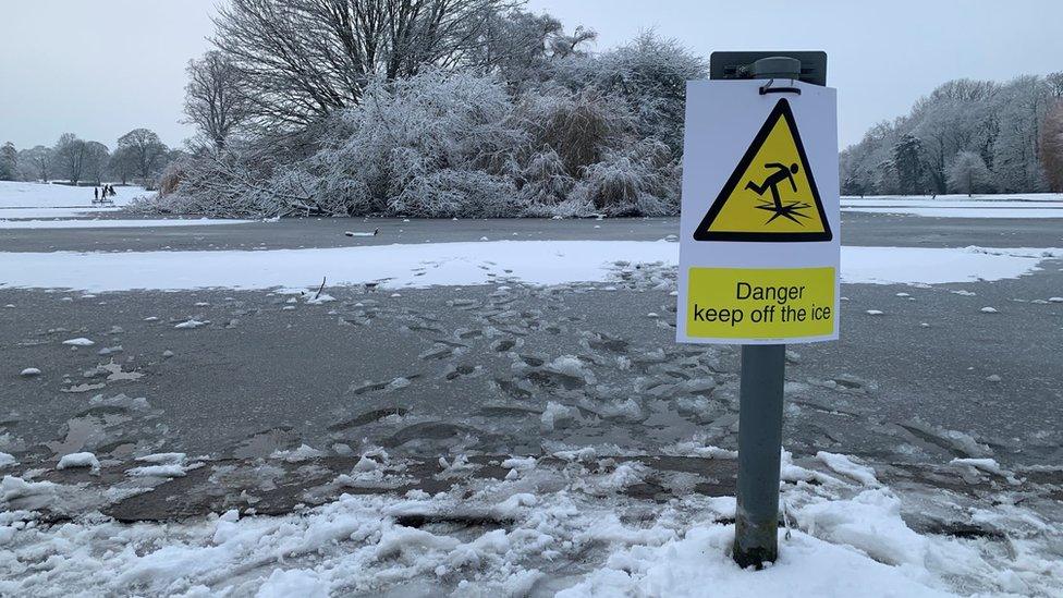 Warning notice at frozen lake in St Albans' Verulanium Park