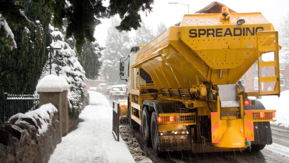 Yellow snowplough and gritter in England