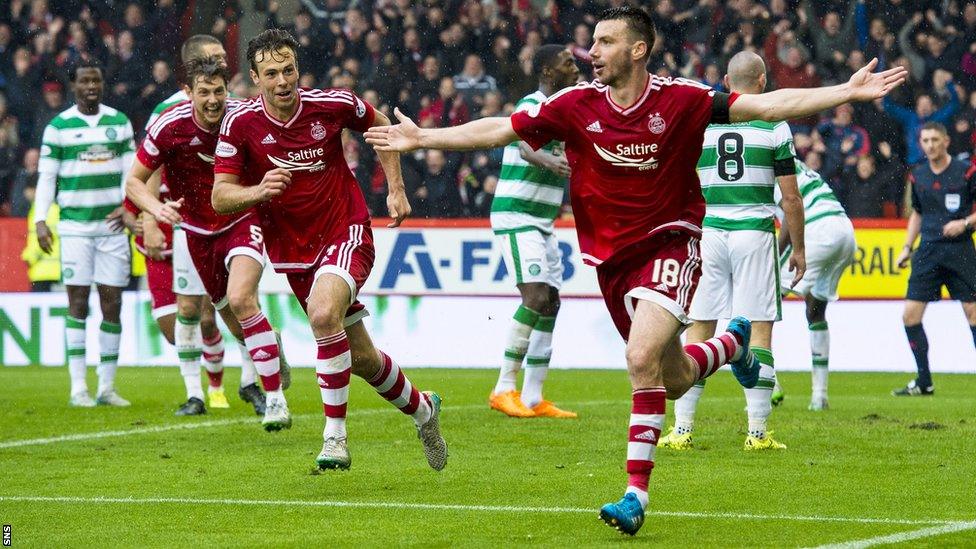 Paul Quinn celebrates after scoring for Celtic against Aberdeen