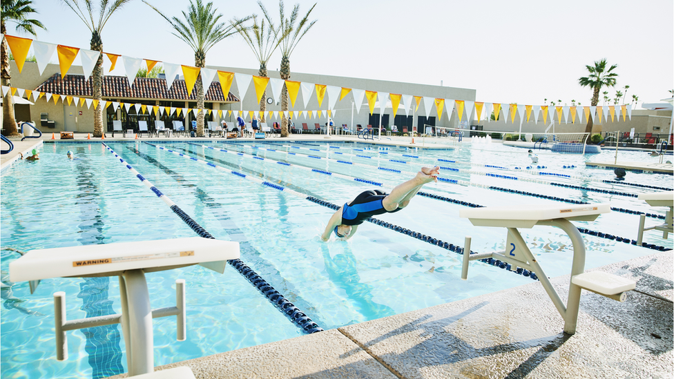 Woman diving into pool