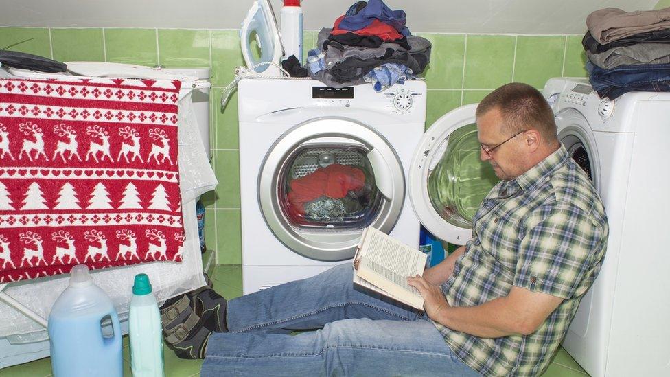 Man at washing machine