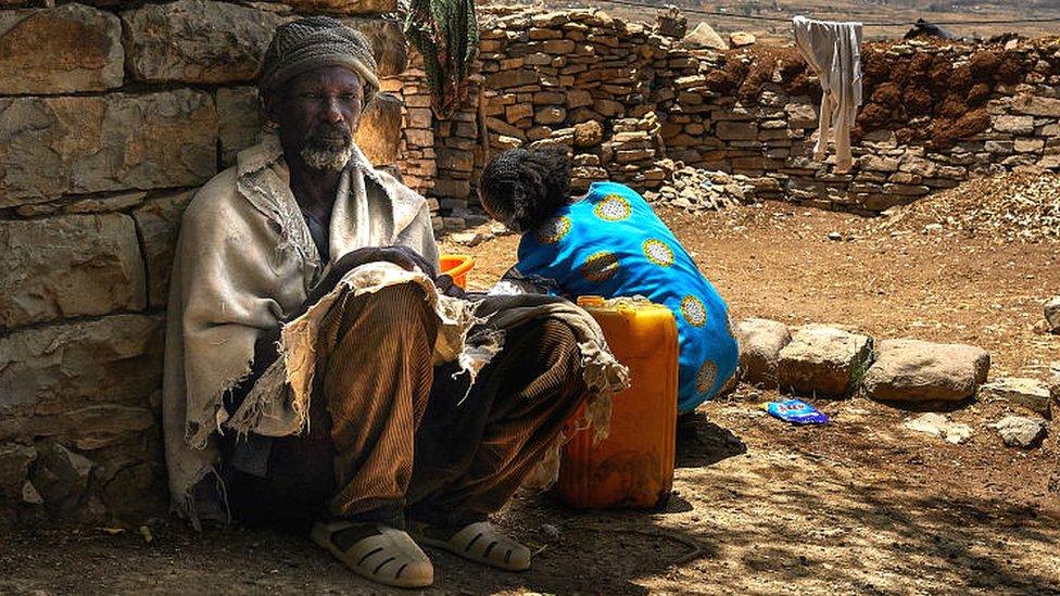 A family in rural southern Tigray collects water.