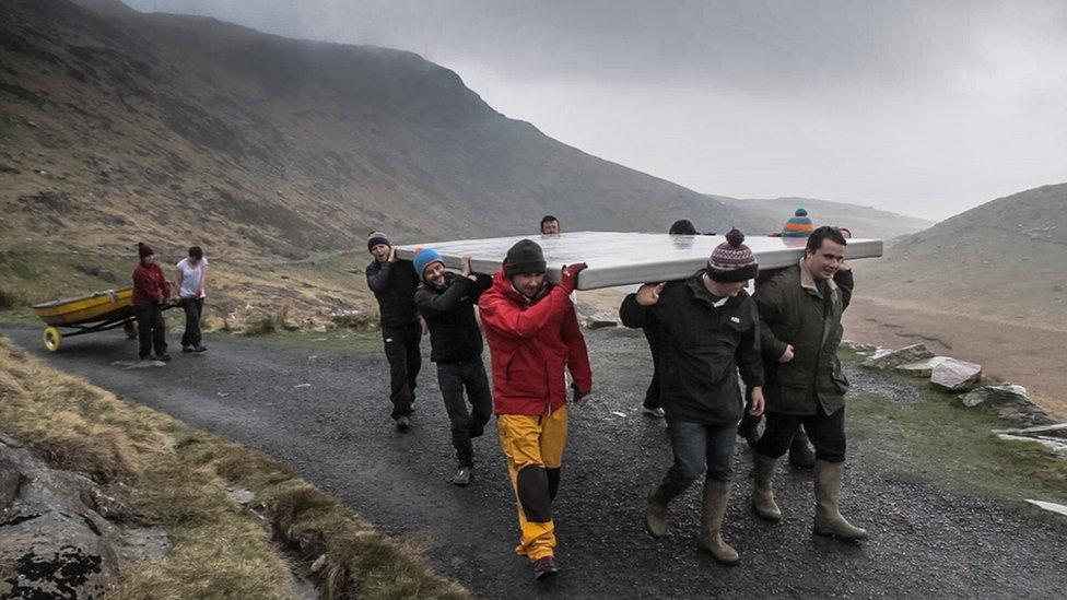 Carrying panel and boat up Miners' Track to Llyn Llydaw