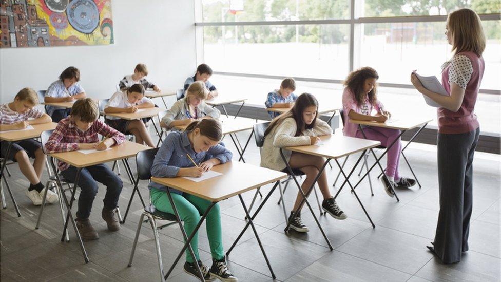 Teacher with pupils in classroom